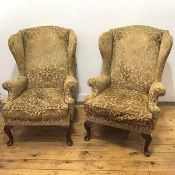 A pair of late 20thc Parker Knoll wing armchairs with olive green foliate upholstery, on cabriole