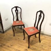 A pair of early 20thc mahogany side chairs, each with arched back and pierced splat, above a