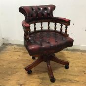 A reproduction leather and turned wood desk chair by Centurion Furniture, the hoop shaped frame with