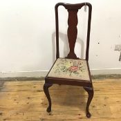 An early 20thc Queen Anne style side chair, the yoke top rail over a solid baluster shaped splat,