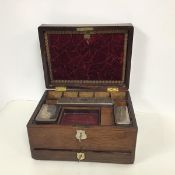 An Edwardian travelling toilet case, the hinged lid with an inlaid mother of pearl plaque, with
