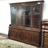 A good quality mahogany and satinwood banded bookcase in the Georgian style, the projecting