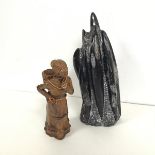 A ceramic glazed figure of a Carrier Woman with basket (a/f) (h.21cm), a stone carved sculpture,