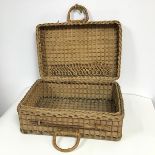 A vintage wicker picnic basket with a hinged top with interior braided holding band (hinge a/f) (