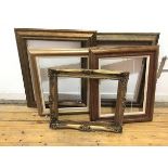 A set of five gilt picture frames, all moulded, two with carving, one composite (largest: 68cm x
