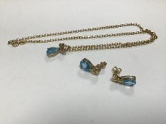 A 9ct gold mounted pear shaped blue zircon style stone on belcher chain (26cm) and a pair of similar