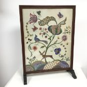 An embroidered floral panel, c.1930, with roses, thistle, bees and butterflies, all within a