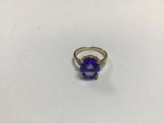 A 14ct gold tanzanite coloured stone dress ring, mounted in claw setting (Q) (2.94g)