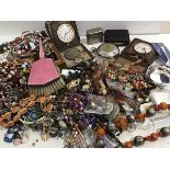 A collection of costume jewellery including bead necklaces, brooches, paste brooches, Nepalese style