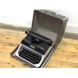 A Vintage child's Lilliput portable typewriter complete with original case, complete with key