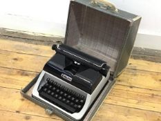 A Vintage child's Lilliput portable typewriter complete with original case, complete with key