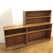 A 1970s wooden open bookcase of asymmetrical form, the raised back enclosing a single shelf, with