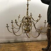 A brass pendant chandelier in the 18thc Dutch taste, the baluster shaped stem with scrolling