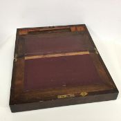 A 19th century walnut travelling writing slope with rectangular hinged top with fitted interior