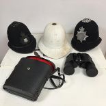 A 1966 pith helmet, size 6 7/8, lacking finial, a British Transport Police helmet and a Durham