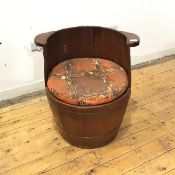 An oak and brass bound seat of coopered construction, adapted from a barrel, with drop in circular