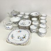 A Tuscan china teaset comprising twelve cups and saucers, eleven tea plates, two sandwich plates,