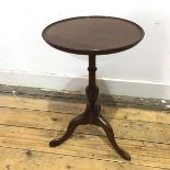 A 19thc mahogany wine table with dished top on turned support with gadrooned knop, on tripod base