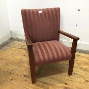 A 1950s child's easy chair, the back and seat upholstered in pink striped upholstery, on square