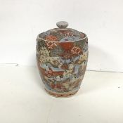 A Satsuma style lidded pot with polychrome enamel and gilt decoration and two panels featuring