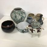 A collection of stoneware pottery including a baluster shaped vase (h.19cm x d.21cm), two mugs,