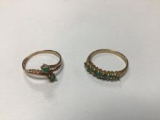 A 9ct gold five stone graduated emerald and diamond chip ring (M) and a 9ct gold crossover ring