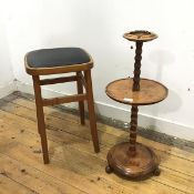 A 1940s oak smoker's stand, of typical form, on bobbin turned shaft with dished base (h.69cm) and