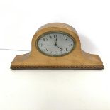 A mid 20thc French mantel clock, the metal dial with arabic numerals within a beech frame with a