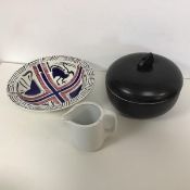 An Art Deco style serving bowl, the lid having a stylised swan finial, with black ribbed exterior