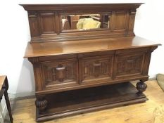 An oak Edwardian sideboard, the upper tier of back on moulded frieze supported by two Ionic