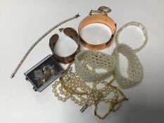 A mixed lot including paste pearl bracelets, copper bangles, a silver gilt paste set tennis