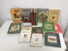 A group of children's books including works by Beatrix Potter, The Tale of Peter Rabbit and Ginger