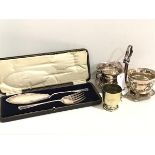 A pair of Epns fish servers complete with fitted case, an Epns stand with sugar basin and milk jug