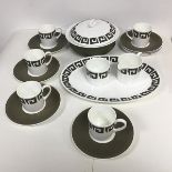 A Wedgwood Susie Cooper teaset including five cups, sugar bowl and creamer, an ashet and a lidded