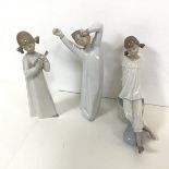 A set of three Lladro figures including Boy Yawning, Girl with Instrument, and Girl Seated (tallest: