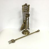 A set of brass fire tools on stand including tongs, shovel, poker and brush also a brass toasting