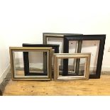 A mixed lot of frames, two gilt, two ebonised and one painted green and partial gilt, all moulded (
