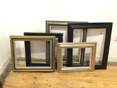 A mixed lot of frames, two gilt, two ebonised and one painted green and partial gilt, all moulded (