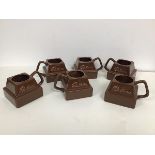 A set of six Cadbury Chocolate novelty mugs in the form of a square of chocolate with handle to side