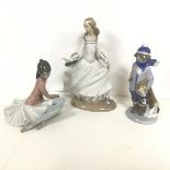 A set of three Lladro figures, including Cinderella, Ballerina and Child on a Winter's Walk (