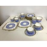 A Gladstone china teaset all with gilt Neoclassical decoration and sky blue ground, including six
