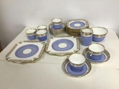 A Gladstone china teaset all with gilt Neoclassical decoration and sky blue ground, including six