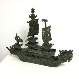 A Chinese jade dragon boat having three masts and two dragon head figures at bow, carved