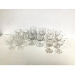 A set of six thumb cut port glasses, one slightly larger, four thumb cut sherry glasses, six crystal