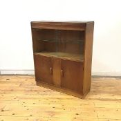 A 1930's oak display cabinet by Robert John Anderson of Edinburgh, the rectangular top above a