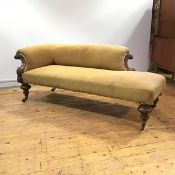 A Victorian mahogany day bed c. 1860, the upholstered back and seat raised on turned vasiform