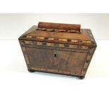 An early Victorian walnut tea caddy with Tunbridgeware banding, of sarcophagus form, raised on