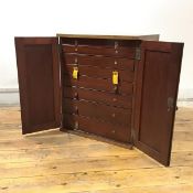 An Edwardian mahogany collector's cabinet, of rectangular form, with exposed tenon construction, the