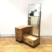 A 1930's oak dressing chest by Robert John Anderson of Edinburgh, of asymmetric form, with a bank of