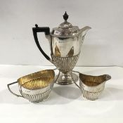 A composed late Victorian silver three-piece coffee service, the pot George Edward & Sons, Sheffield